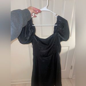 Francesca’s black satin dress with puff sleeves